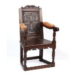 Property of a lady - a carved oak caqueteuse type armchair, parts 17th century.