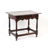 Property of a deceased estate - an early 18th century oak side table, with frieze drawer & shaped