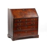 Property of a deceased estate - a George II provincial walnut fall-front bureau, 37.5ins. (95.2cms.)