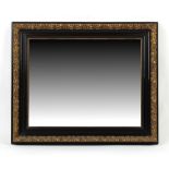 Property of a deceased estate - an ebonised & gilt rectangular framed wall mirror, the frame late
