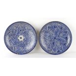 Property of a lady - a large pair of Moroccan Fez blue & white pottery shallow dishes, each