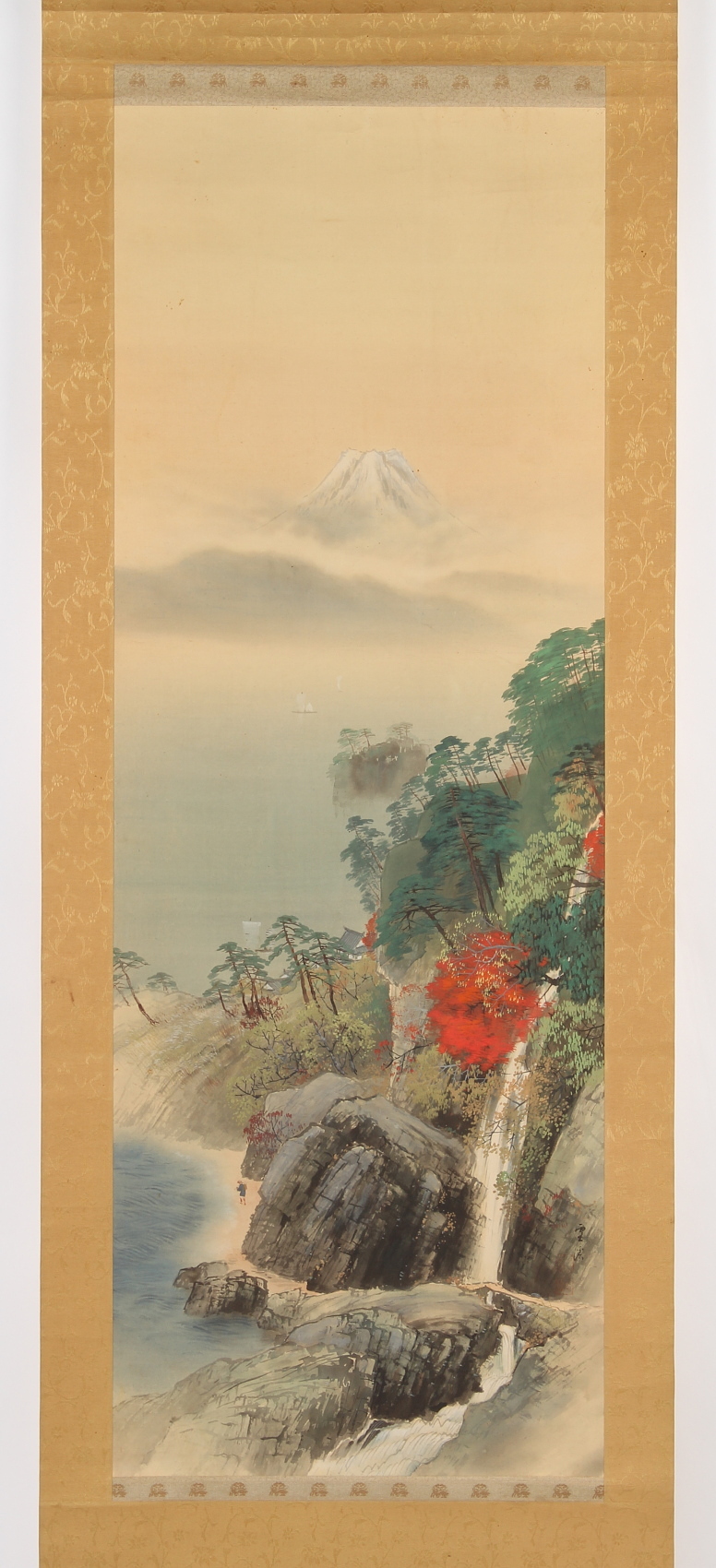 A Japanese scroll painting on silk depicting a mountainous river landscape, the painting 44.7 by