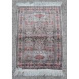 Property of a gentleman - a finely woven silk small rug, 36 by 24ins. (91 by 61cms.).
