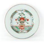 Property of a gentleman - a Chinese famille verte shallow dish with sgraffito decorated rim,