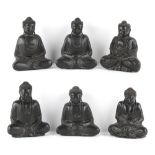 Property of a gentleman - a group of six black painted carved wood figures of Buddha, the tallest