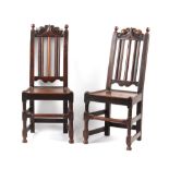 Property of a gentleman - a pair of late 17th century oak high-back chairs with carved scroll