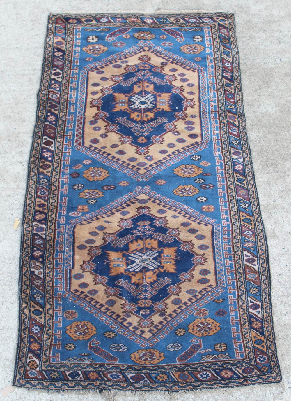 Property of a lady - a Caucasian rug, with pale blue ground, 97 by 51ins. (247 by 130cms.).