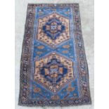 Property of a lady - a Caucasian rug, with pale blue ground, 97 by 51ins. (247 by 130cms.).
