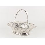 Property of a deceased estate - a George III silver pierced oval bread basket with swing handle,