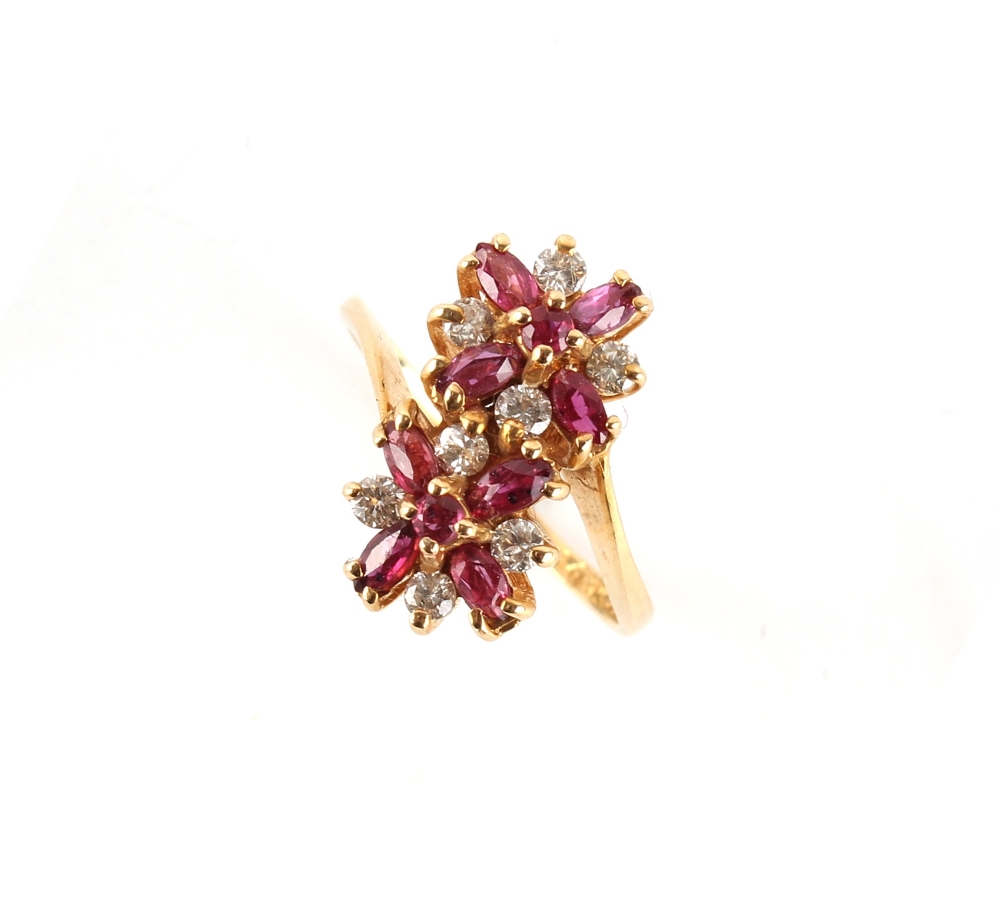 Property of a lady - a 14ct yellow gold ruby & diamond double flowerhead cluster ring, set with