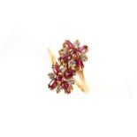Property of a lady - a 14ct yellow gold ruby & diamond double flowerhead cluster ring, set with