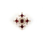 A 19th century garnet & pearl cross pendant, 34mm across.