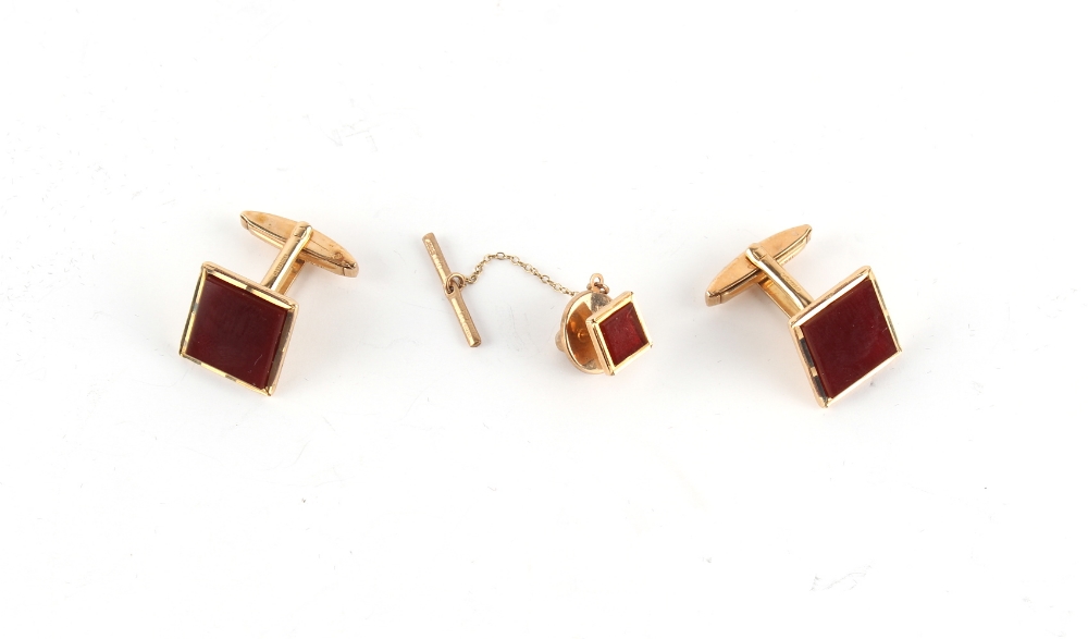 Property of a gentleman - a pair of 9ct gold carnelian square panel cufflinks; together with a