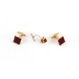 Property of a gentleman - a pair of 9ct gold carnelian square panel cufflinks; together with a