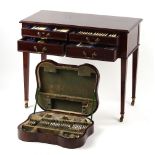 Property of a lady - an Edwardian mahogany cutlery canteen table containing an extensive &