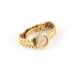 Property of a lady - a lady's Ebel 18ct yellow gold cased wristwatch, with pale pink dial, on 18ct