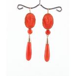 A pair of 19th century carved coral drop earrings, each approximately 55mm long (2).