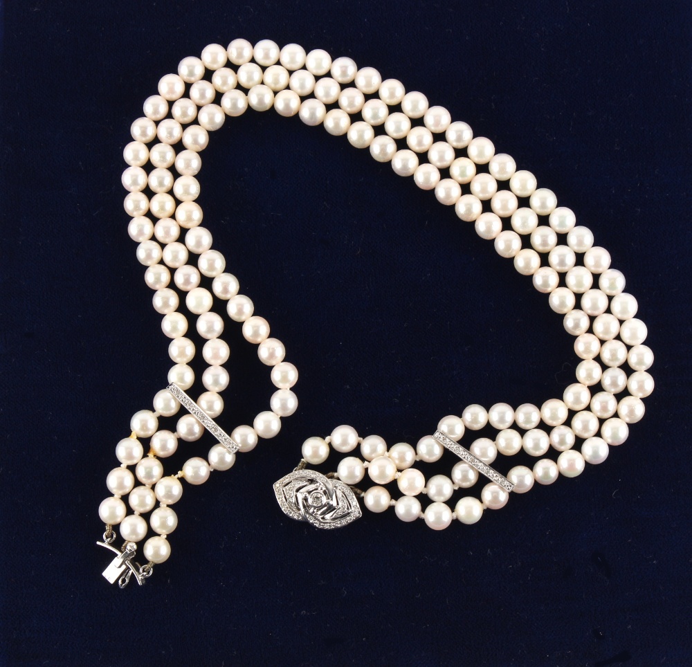 Property of a lady - a cultured pearl three row necklace with 18ct white gold diamond clasp & spacer