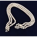 Property of a lady - a cultured pearl three row necklace with 18ct white gold diamond clasp & spacer