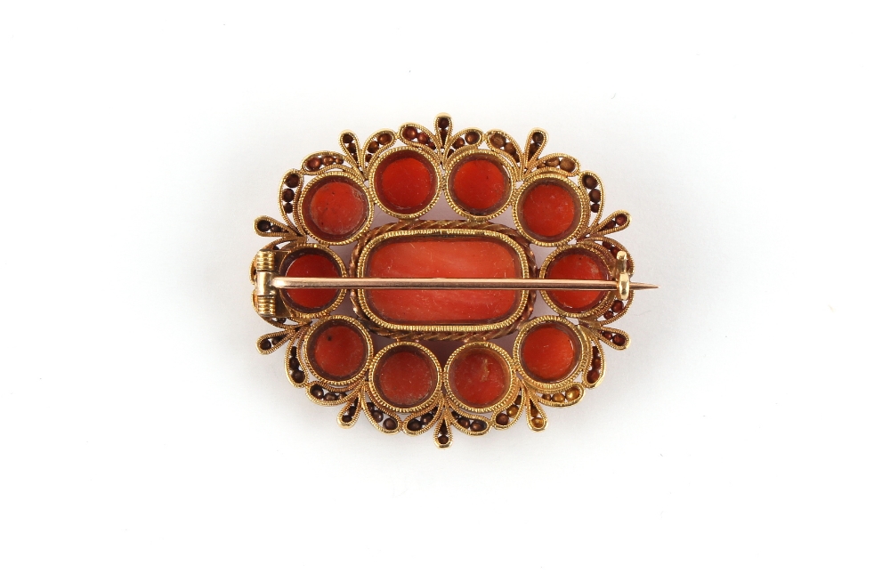 A late 19th / early 20th century unmarked gold (tested) carved coral oval brooch, 34mm wide ( - Image 2 of 2