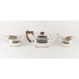 Property of a gentleman - an early 20th century Art Deco silver three piece tea set, Edward &