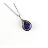 An 18ct white gold large tanzanite & diamond pear shaped pendant on 18ct white gold chain