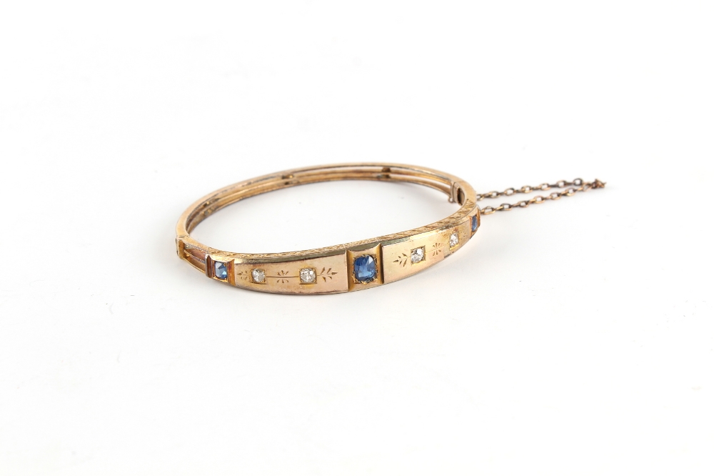 Property of a lady - a late Victorian unmarked gold sapphire & diamond hinged bangle, the largest