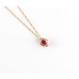 En suite with the preceding lot - a 14ct yellow gold ruby & diamond pendant on chain necklace, the