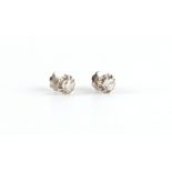 Property of a lady - a pair of unmarked white gold diamond flowerhead stud earrings, with screw