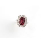 An Art Deco style unmarked white gold or platinum rubellite tourmaline & diamond ring, the octagonal