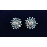 A good pair of 18ct white gold pale blue topaz & diamond flowerhead earrings, possibly Asprey,