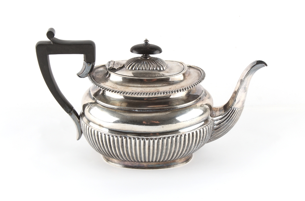 Property of a lady - a late Victorian silver teapot with half fluted decoration, Harrison Brothers &