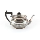 Property of a lady - a late Victorian silver teapot with half fluted decoration, Harrison Brothers &