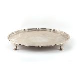 Property of a lady - a large late Victorian silver salver or waiter, with hoof feet, Charles