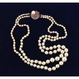 A cultured pearl graduated two strand necklace, the largest pearl approximately 9.4mm, on 14ct white