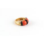 Piaget - an 18ct yellow gold coral & black onyx ring, with textured shank, signed PIAGET, size L/M.