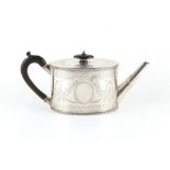 Property of a lady - a Victorian silver teapot, of oval form with engraved decoration, William