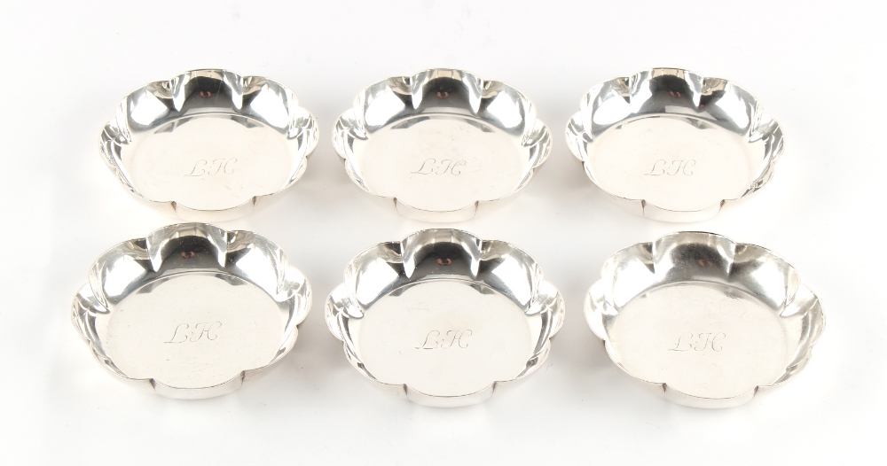 Property of a lady - a set of six silver petal rimmed small dishes, each with engraved initials to