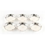 Property of a lady - a set of six silver petal rimmed small dishes, each with engraved initials to