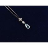 An aquamarine & diamond pendant on 14ct white gold chain necklace, the pear shaped cut aquamarine