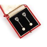 A pair of Art Deco style natural saltwater pearl & diamond drop earrings, the two large certificated