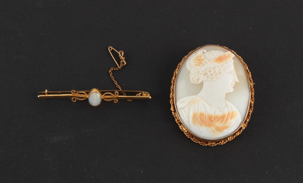 Property of a lady - a 9ct gold opal bar brooch, the pin steel, 55mm long, approximately 2.6 grams