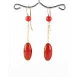 A pair of unmarked gold coral & pearl pendant earrings, each approximately 49mm long (2).