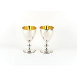 Property of a deceased estate - a pair of silver goblets, with gilt interiors & beaded borders, each