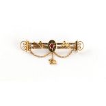 Property of a deceased estate - a late Victorian 15ct gold & round cut red spinel brooch decorated