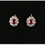 Property of a lady - a pair of ruby & diamond oval cluster earrings, with screw fastenings, the oval