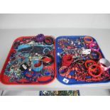 A Variety of Modern Costume Jewellery Beads, Necklaces, Bangles, Ornate Necklaces, etc:- Two Trays