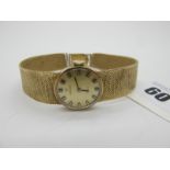 Tissot; A 9ct Gold Cased Ladies Wristwatch, the signed circular dial with block markers, within