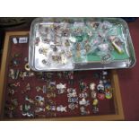 Golly Badges, large quantity in display cabinet and tray.