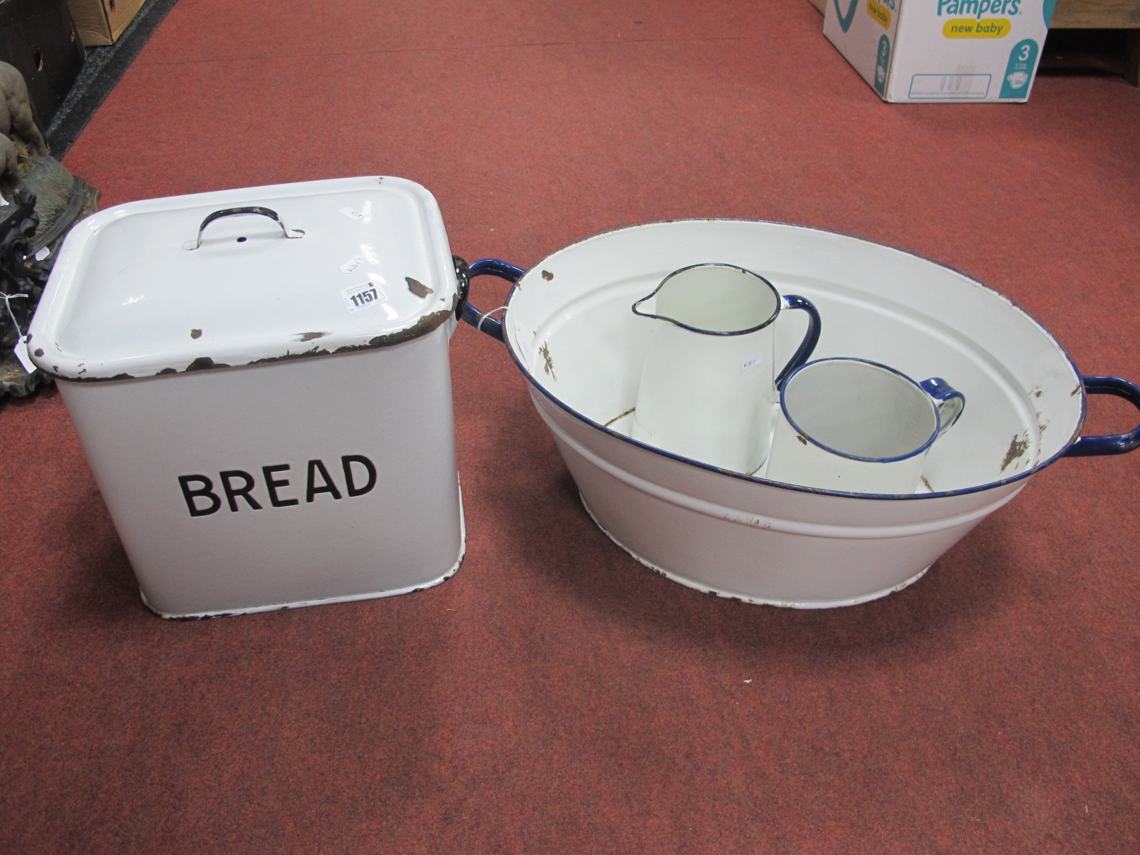 A Vintage Enamel Bread Bin, together with an enamel twin handled bowl, and two jugs. (4)